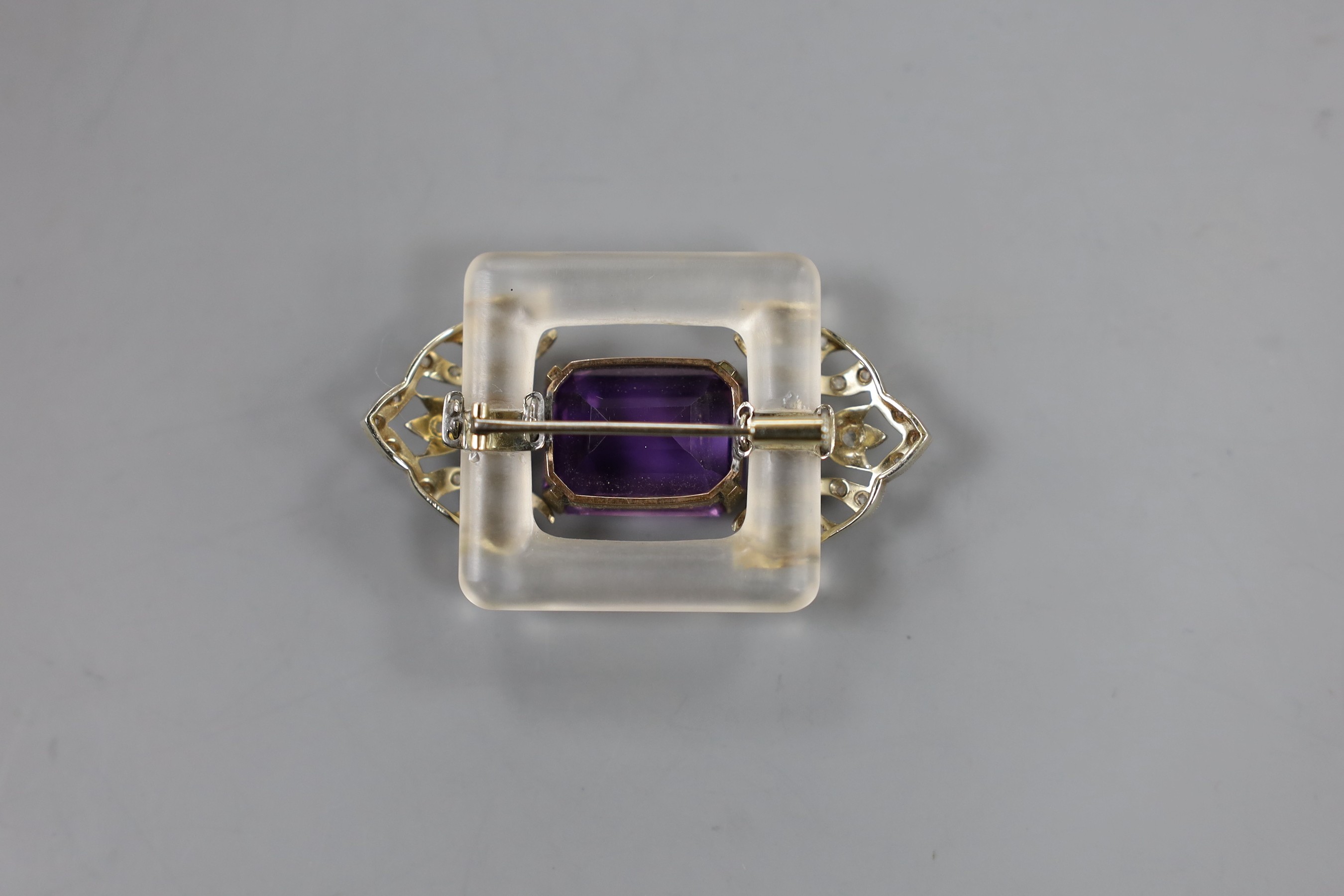 An Art Deco style yellow and white metal, amethyst, rose cut diamond and frosted glass set shaped rectangular brooch, 48mm, gross weight 16.2 grams.
